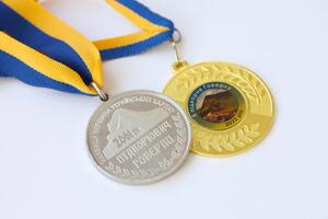 KYIV, UKRAINE - MAY 4, 2022 Medal for the person who conquered Mount Hoverla photo