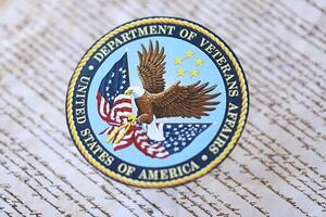 KYIV, UKRAINE - MARCH 9, 2024 US Department of Veteran Affairs seal on United States Constitution photo