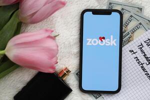 KYIV, UKRAINE - FEBRUARY 23, 2024 Zoosk logo of famous dating website or app on iPhone display photo
