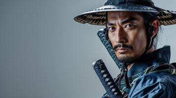 Intense portrait of a Samurai warrior in traditional Japanese armor wielding a katana photo