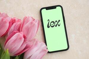 KYIV, UKRAINE - FEBRUARY 23, 2024 Lex logo of famous dating website or app on iPhone display photo