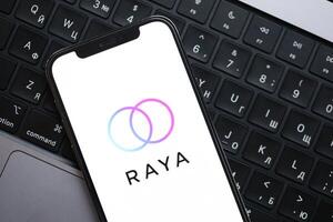 KYIV, UKRAINE - FEBRUARY 23, 2024 Raya logo of famous dating website or app on iPhone display photo