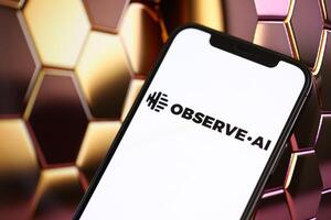 KYIV, UKRAINE - MARCH 17, 2024 ObserveAI logo on iPhone display screen with background of artificial intelligence futuristic image photo