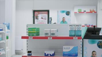 Boxes of prescribed medicine displayed in empty drugstore, awaiting clients to purchase or include under medical coverage. Pharmacy equipped with nutritional products and pharmaceutical drugs. photo