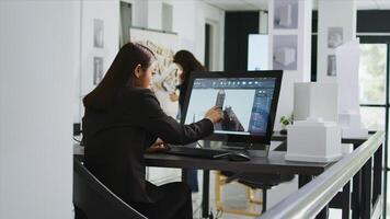 Architect reviewing residential area building plans on pc, working with interactive screen to design and outline property elements. Technician preparing for project in startup coworking space. photo