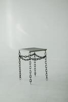 Metal Chair Made Of Chains On Cyclorama photo