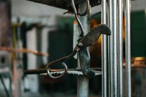 Scissors for cutting molten glass in a workshop photo