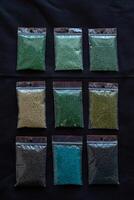 Plastic bags filled with colored beads photo