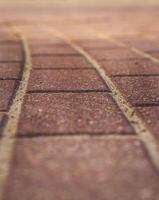 Close up shot of the interlocked bricks of the pavement surface. Texture photo