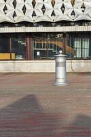 Shot of the outdoor trash bin and ashtray. City photo