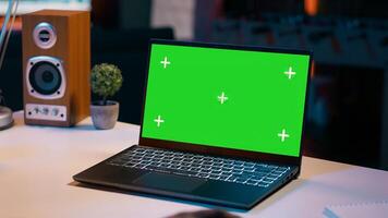 University student checks greenscreen display on laptop at home, improving her education and using isolated chromakey layout on wireless device. Girl looks at mockup screen. Camera A. photo