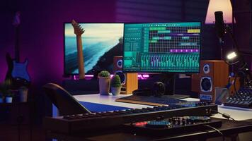 Empty studio at home equipped with mixing soundboard panel and other musical instruments, music industry recording. Modern space with electronic controls and daw software on pc. Camera A. photo