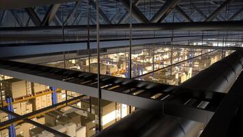 Massive storage facility loaded with goods and products, arranged on metal racks tagged with barcodes and identification labels. Warehouse handling shipping and sales activities. photo