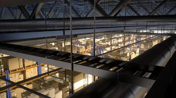 Massive storage facility loaded with goods and products, arranged on metal racks tagged with barcodes and identification labels. Warehouse handling shipping and sales activities. photo