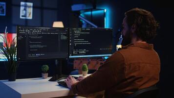 Developer arriving in apartment office with coffee mug in hand, ready to start coding on computer. IT specialist begins teleworking job shift, holding cup of tea, upgrading company software, camera B photo