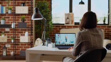 Patient remotely discussing treatment plan with doctor during online videocall meeting after medical checkup. Woman receiving prescription from general practitioner in telemedicine call, camera B photo