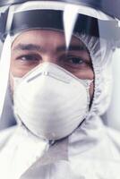 Close up of virus scientist wearing ppe equipment in microbiology laboratory during covid19. Overworked researcher dressed in protective suit against invection with coronavirus during global epidemic. photo