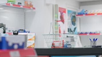 Empty drugstore cash register with boxes of pills or vitamins, having pharmaceutical products and medical supplies for sale on shelves. Pharmacy providing prescription medicine or other treatments. photo