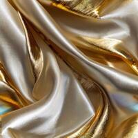 A background with silk white fabric luxurious gold textures. photo