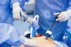 Instruments for gastroscopy and colonoscopy close-up. The doctor holds a flexible endoscope and biopsy forceps in his hands. Endoscopy and minimally invasive surgery photo