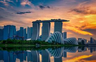 Singapore Skyline and view of skyscrapers on Marina Bay view from the garden by the bay at sunset time photo