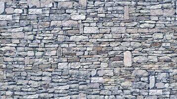 Stone wall texture block rustic stone old background texture photo