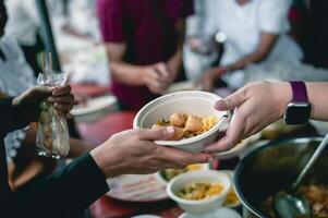 Helping the poor in society by donating food . The concept of hunger photo