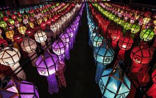 Lanterns made of colorful paper are hung during the annual festival at Wat Phra That Hariphunchai in Lamphun Province. photo