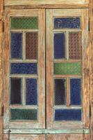 Wooden framed windows and stained glass decorated in retro style. photo