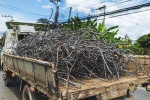 Trucks transporting used rebar for reprocessing. photo