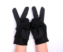 negro paño palma guantes con antideslizante agarre, aislado en blanco antecedentes. foto