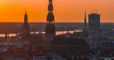 Aerial panoramic sunset over Riga old town in Latvia. Beautiful spring sunset over Riga. Golden hour fire sunset. photo