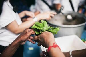 The concept of sharing. Participation in sharing food for the poor photo