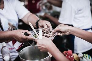 Charity food for the poor and the homeless . The concept of food shortage and hunger photo