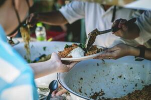 Sharing food with the poor. Ideas for helping with hunger problems photo