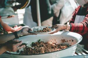 Sharing food with the poor. Ideas for helping with hunger problems photo