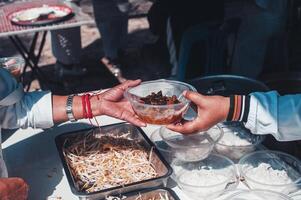 Feeding concept Homeless people offer free food from outdoor volunteers. photo