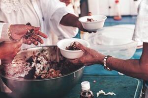 Feeding concept Homeless people offer free food from outdoor volunteers. photo