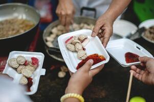 Sharing warm food for homeless and homeless people photo