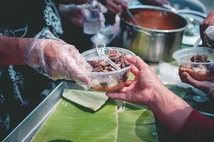 Food donations to fight hunger by sharing free food with people photo