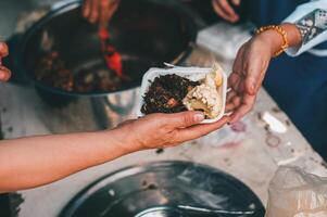 Sharing warm food for homeless and homeless people photo