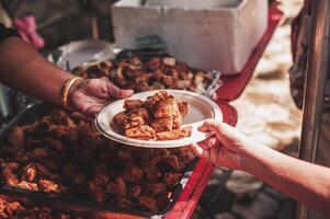 Hungry homeless people request free food donations from volunteers social concept of helping photo