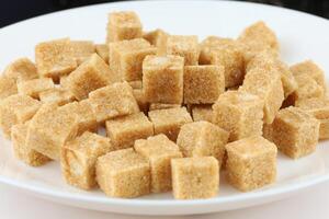 Lots of brown sugar cubes. photo