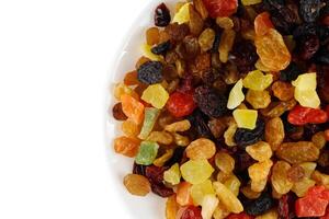 Dried exotic fruits on a plate. photo