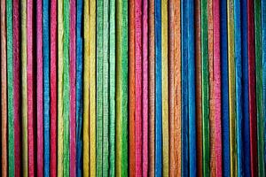 Multi colored wooden craft sticks, colorful background photo