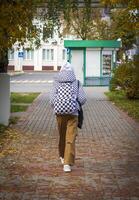 Concept shot of the person walking on an empty street. Season photo