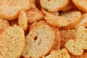 Bread croutons snacks with spices close-up. photo