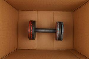 Sports dumbbell in a box photo