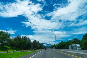 Bogor West Java, March 5, 2024 - highway with views of the sky above the mountains. photo