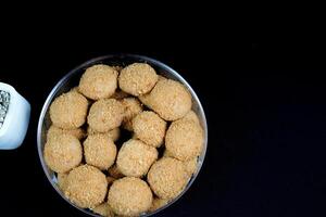 close up view of a beautiful chestnut cake on a black background. photo